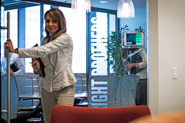 woman walking through door